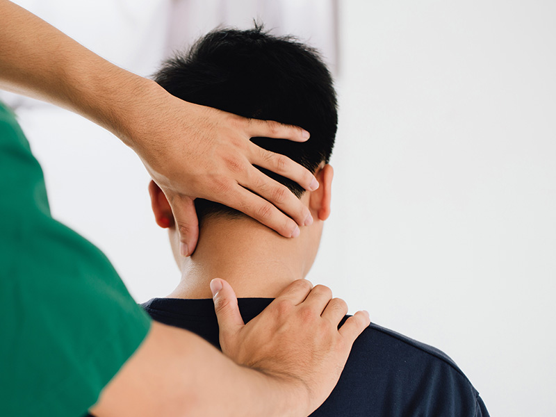 Patient getting their neck adjusted