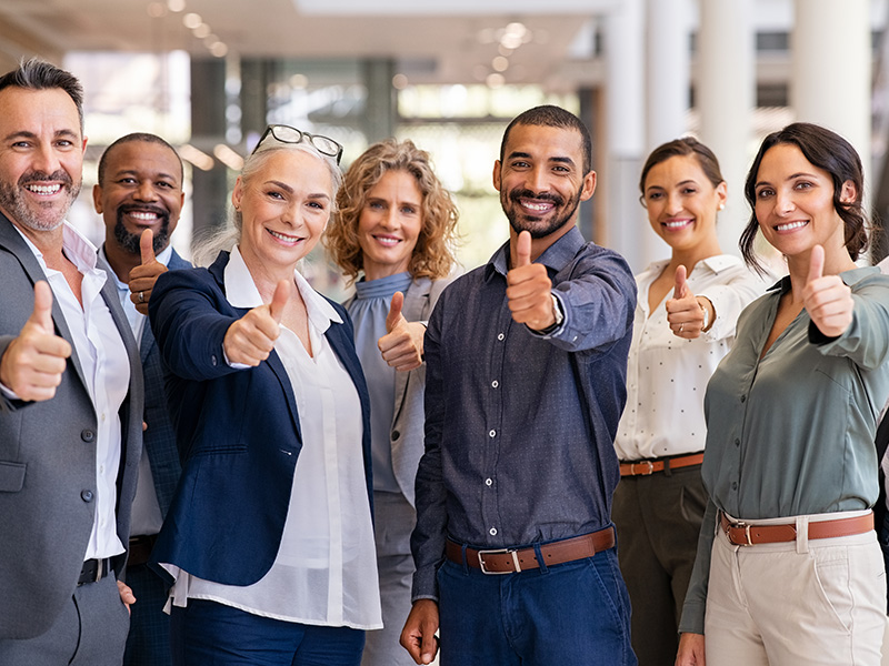 Group of people giving thumbs up