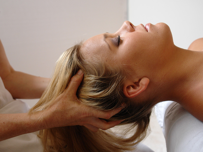 Woman getting hair and head massaged