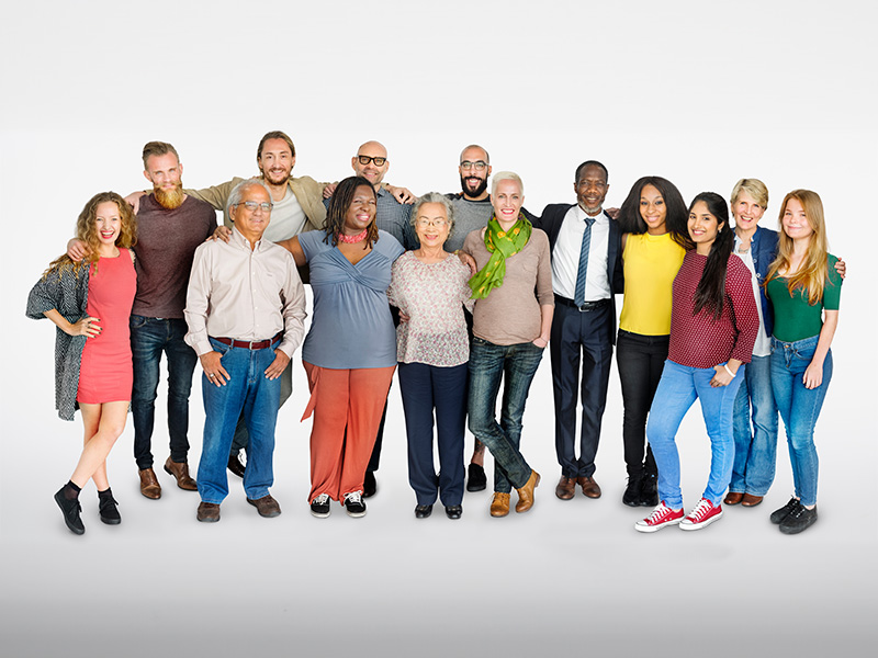 Group of happy people smiling and having their arms on each other